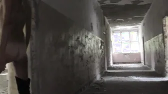 Blonde leggy cougar inside high boots walks naked through abandoned building. She spreads her cunt.