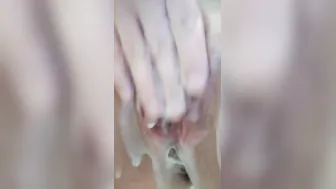 Dripping twat washes into the shower and ejaculates