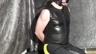 Female Domination bound up man with yoga panel gag and leather hood