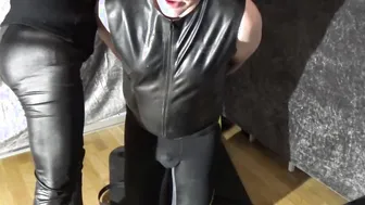 Female Domination bound up man with yoga panel gag and leather hood