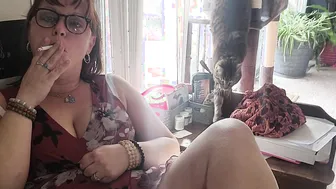 Hot dark haired secretary enjoys a smoke
