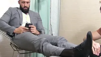 Handsome bearded businessman toes licked and worshipped