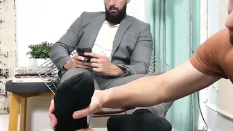 Handsome bearded businessman toes licked and worshipped