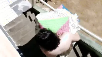 Nudist housewife taking tub inside front yard