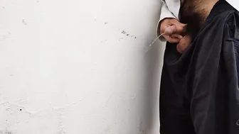 White boy pee into a white wall