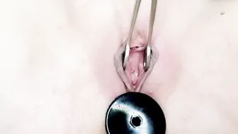 Anal plug inside babes booty. Opening the labia