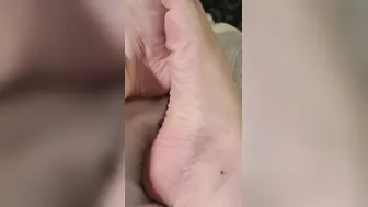 Taking tape of my new red pedicure close up feet toe wiggle soles