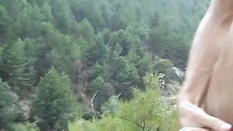 Wank with a watch. Masturbation on a mountain. Touching my skinny oiled body public.