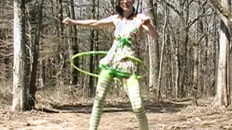 Mom into swimsuit plays with Hula Hoop