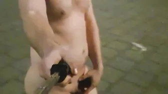 Walking nude through town with a toy