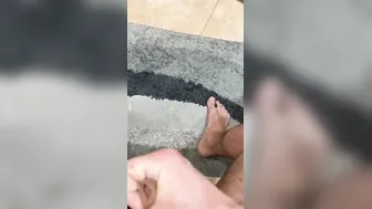 The dude jerks inside the restroom and ejaculates at the door