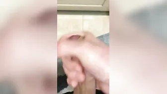 the dude jerks inside the restroom and ejaculates at the door