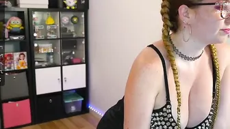 Nerdy Goth women with a heavy metal bra with Spikes