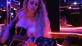 Having Fun guitar and singing a cover topless into club