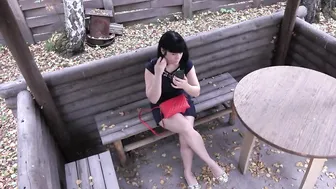 Voyeur with a secret camera spying on dark haired outdoors. Outside pee and