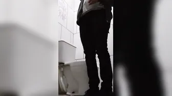 backpack dude drinking water and pissing