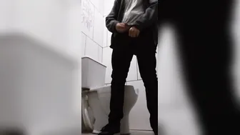 backpack dude drinking water and pissing