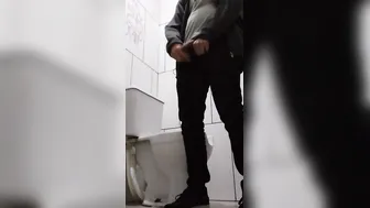 backpack dude drinking water and pissing