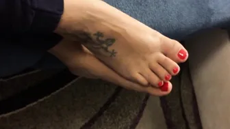 Mom shows her babe toes with red nail polishwaiting for someone to lick them.....