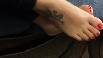 Mom shows her babe toes with red nail polishwaiting for someone to lick them.....
