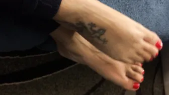 Mom shows her babe toes with red nail polishwaiting for someone to lick them.....