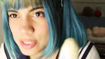 Deep throat: school girl slides a whole banana into her mouth.