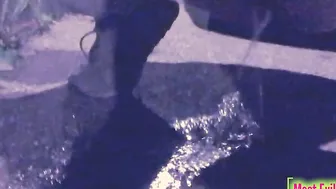 chick alone at night into a parking lot lowers her