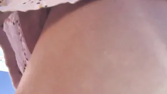 Petite chick without underwear into short shorts. Outdoors. Naked cunt.