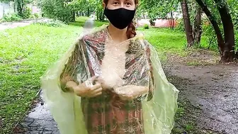 Chick inside a raincoat flashing boobs and butt on the