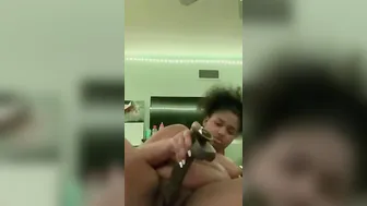 BBW ducking herself with a big black dick didlo
