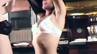 A blonde and a dark hair satisfaction each other with tongues and various sex toys