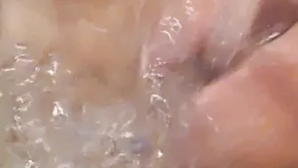 Bathtub fun- letting the water flick my clitoris and nipples