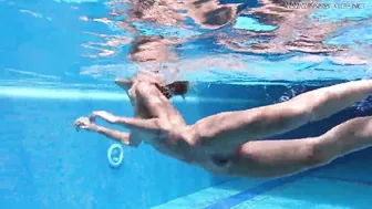 Tiffany Tatum escorted by Jack inside swimming pool