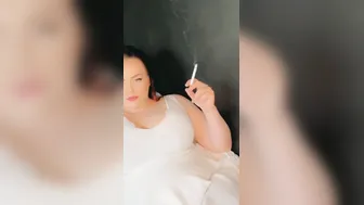Bella smoking into a amazingly hot white dress