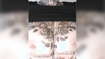 Gigantic melons play with pierced nipples and tattoos