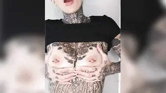 Gigantic melons play with pierced nipples and tattoos