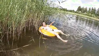 Having Fun with a Water Donut Nude into the Lake