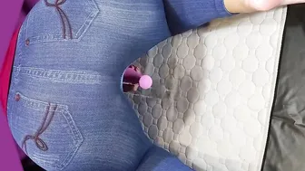 Gigantic butt into jeans peeing with toy