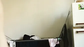 Nude housemaid doing housework.