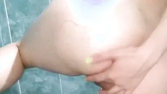 With a bikini inside the shower masturbating inside front of