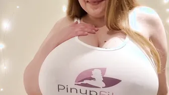 Sara Wiilis wearing a tank top focusing her enormous boobs