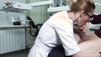 A Ukrainian doctor with glasses grabs the patients dick and