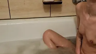 she massages her soak snatch and tiny boobs while taking a shower