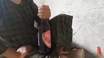 indian local rendi outside drinking beer pee beer bottle
