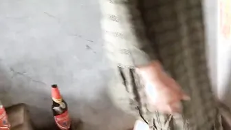 indian local rendi outside drinking beer pee beer bottle
