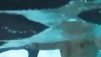 Topless girl drowning underwater