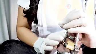 Nurse Edging Chastity Patient into Chastity Cage