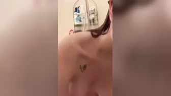 Small slim red haired taking a shower