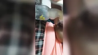 African woman pumps a huge tit for Youtube
