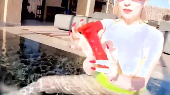Red XXX fucks her snatch with a dildo into the pool